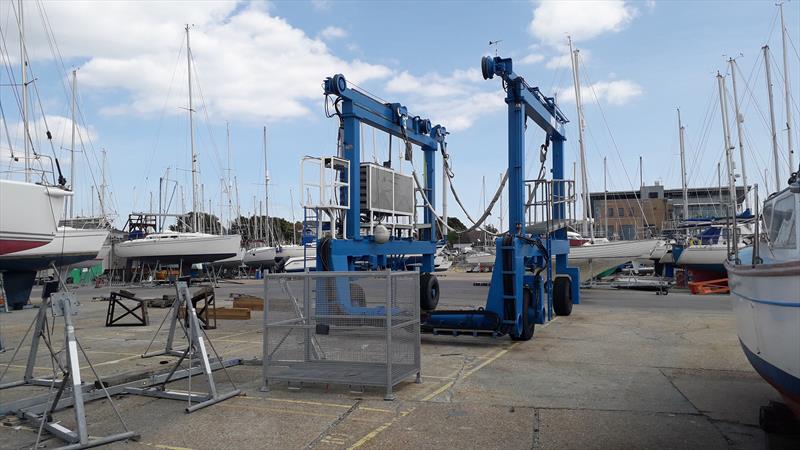 Travel lift for boats sitting unused in Parkstone Yacht Club boat yard