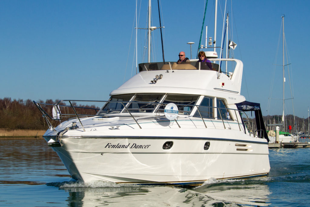 Motorboat cruising on a calm spring day after carrying out spring motorboat checks