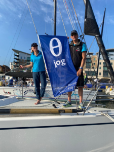 Waving the JOG yacht racing flag